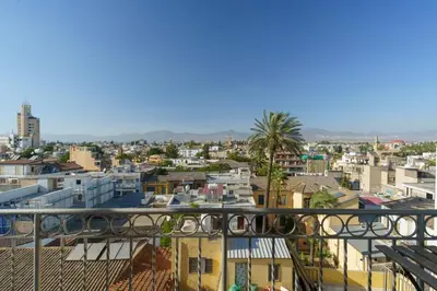 a view of a city from a balcony at Central Penthouse Sky Suite in Nicosia