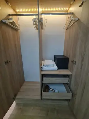 a walk in closet with wooden walls and lights at Plateia Suite Brillante in Nicosia