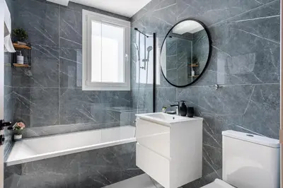 a bathroom with a white toilet and a mirror at Doria 2-Bedroom Apartment & Balcony in Larnaca in Aradhippou