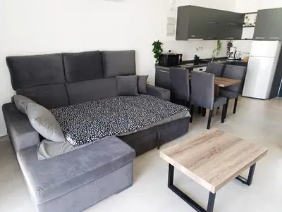 a living room with a couch and a table at Deja Blue Apartments, North Cyprus