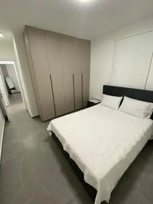 a bedroom with a large white bed in it at Mall View Modern PentHouse in Larnaka