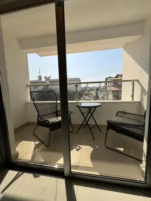a balcony with a table and chairs and a view at Bachelor Court 1 in Ayia Napa