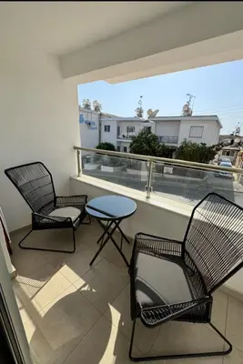 two chairs and a table on a balcony with a view at Bachelor Court 1 in Ayia Napa