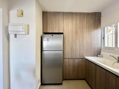 a kitchen with a stainless steel refrigerator and a sink at STAY Almyra House in Protaras