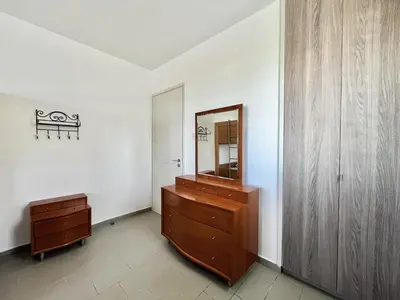 a bathroom with a mirror and a wooden dresser at STAY Almyra House in Protaras