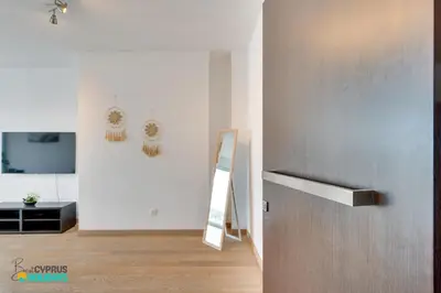 a hallway with a door and a mirror in a room at The lighthouse 1 bedroom 604 in Larnaka