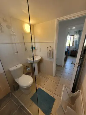 a bathroom with a toilet and a sink at Ayia Napa Marina Luxury Villas - Aquamarine in Ayia Napa