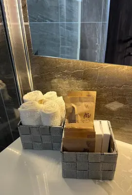 two baskets of towels sitting on a table at Oasis Penthouse Luxury Suite in Limassol