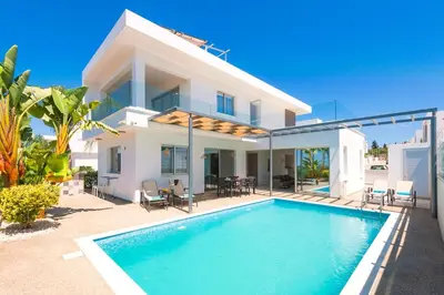 a villa with a swimming pool in front of a house at Elite Panoramic View 3Bdr Villa with pool Ayia Napa in Ayia Napa