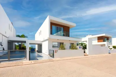 a large white house with a driveway at Royal Panoramic View 3Bdr Villa with pool Ayia Napa in Ayia Napa