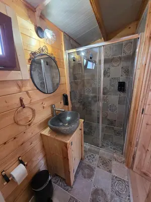 a bathroom with a sink and a shower at Kellaki Relaxation Cottage in Kellaki
