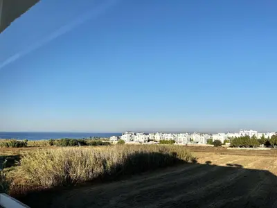 a view of the ocean and a city at STAY Capari Light Apartment in Protaras