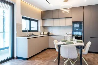 a kitchen with a table and chairs in a room at Itero 2-Bedroom Luxury Apartment in Larnaka
