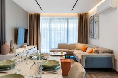 a living room with a couch and a table at Itero 2-Bedroom Luxury Apartment in Larnaka