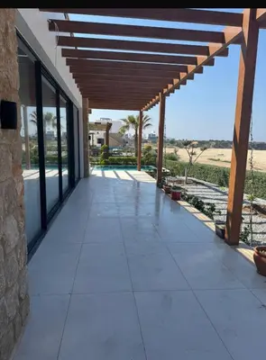 a patio with a view of the desert at Mykonos Homes Villa in Aglantzia