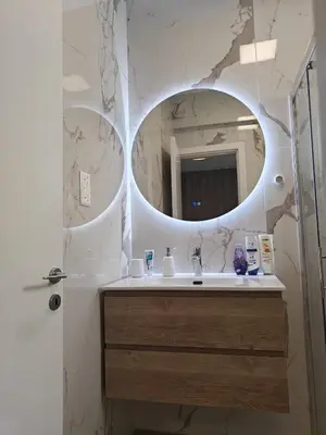 a bathroom with a sink and a mirror at Brand new sea view walking distance to the sea 200m in Limassol
