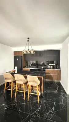 a kitchen with a dining room table and chairs at Long Beach, İskele, Grand Sapphire Resort - Pool View Luxury Studio in Paralimni