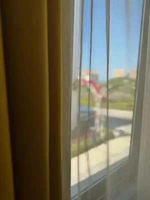 a close up of a window with a view of a street at Modern Seaside Studio at Northern Cyprus - Pearl Island in Pyla