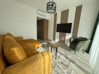 a living room with a couch and a tv at Modern Seaside Studio at Northern Cyprus - Pearl Island in Pyla