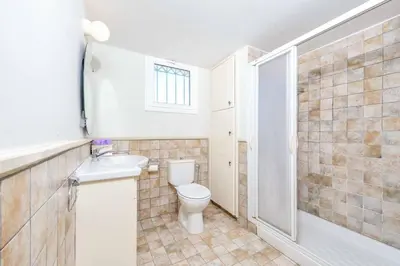 a bathroom with a toilet and a sink and a shower at Villa Marilena in Protaras