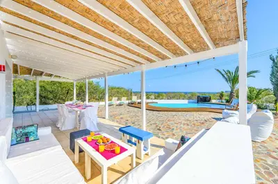 a patio with a table and chairs and a pool at Villa Marilena in Protaras