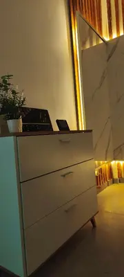 a dresser in a room with a mirror at Light garden in Limassol