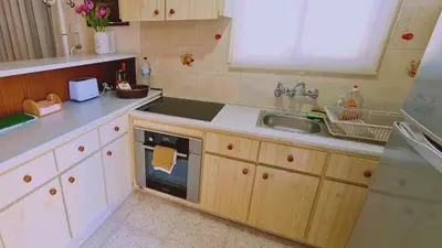 a kitchen with a sink and a dishwasher at STAY Sea Gem Apartment in Meneou