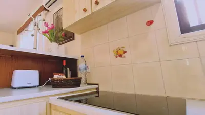 a kitchen with a sink and a counter top at STAY Sea Gem Apartment in Meneou