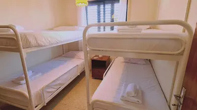a room with two bunk beds and a window at STAY Sea Gem Apartment in Meneou