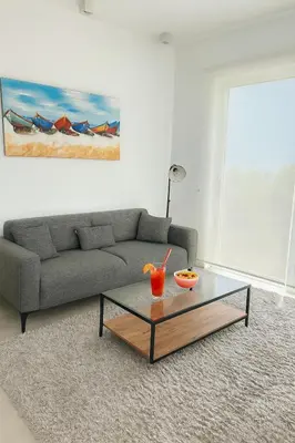 a living room with a couch and a coffee table at Terra Vista in Kérynia
