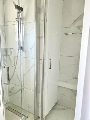a shower with a glass door in a bathroom at Fully Equipped One Bedroom APT in Limassol