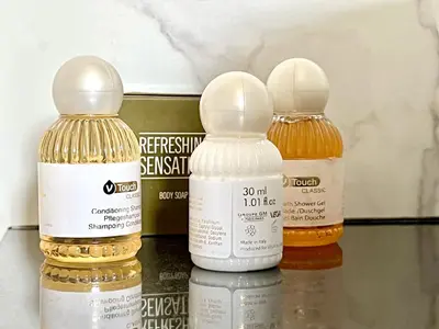 three bottles of essential oils sitting on a shelf at Fully Equipped One Bedroom APT in Limassol