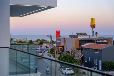 a view of a city from a balcony of a building at Artemis 202 - Seaside Stories in Livadhia