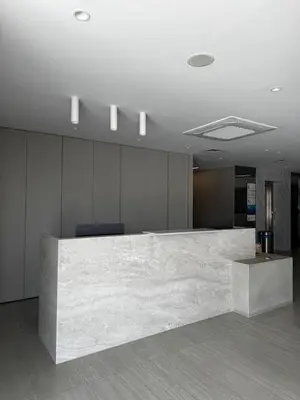 an office lobby with a marble counter top at AppleGym sports centre in Laxia