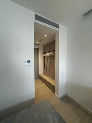 a hallway with a walk in closet at AppleGym sports centre in Laxia