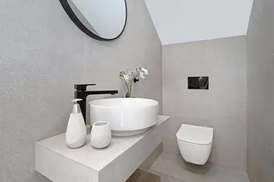 a bathroom with a sink and a toilet and a mirror at Princess Anne Luxury Villa - Large Pool in Protaras
