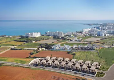 an aerial view of a city with buildings and the ocean at Princess Anne Luxury Villa - Large Pool in Protaras