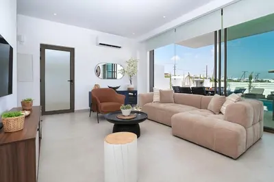 a living room with a couch and a table at Princess Zena Luxury Villa - Large Pool in Protaras