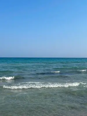 a body of water with waves on a beach at Sunrise Beach Club, Bogaz, North Cyprus in Boğaz