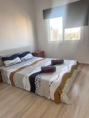 a large bed in a bedroom with a window at Faneromeni 33 in Scala