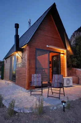 two chairs sitting in front of a barn at Chardonnay Tiny Home for Nature Lovers North Cyprus in Kérynia