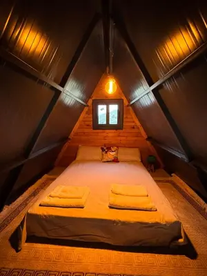 a bed in a small room with a window at Chardonnay Tiny Home for Nature Lovers North Cyprus in Kérynia