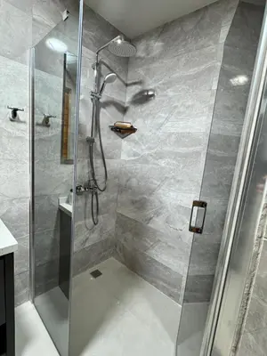 a shower with a glass door in a bathroom at Chardonnay Tiny Home for Nature Lovers North Cyprus in Kérynia