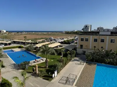 an aerial view of a resort with a swimming pool at Caesar Resort Spa Long Beach