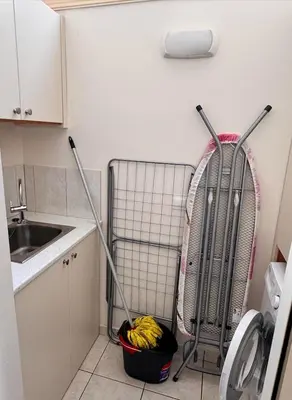 a small kitchen with a cart with bananas in it at Family House in Limassol