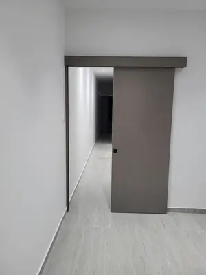 an open door in a room with a hallway at Chryso Apts Protaras in Paralimni