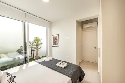 a bedroom with a bed with two towels on it at Protaras Leomi Seaview Villa in Protaras