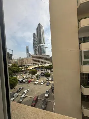 a view of a parking lot in a city at 3 bedroom seafront apartment in Limassol