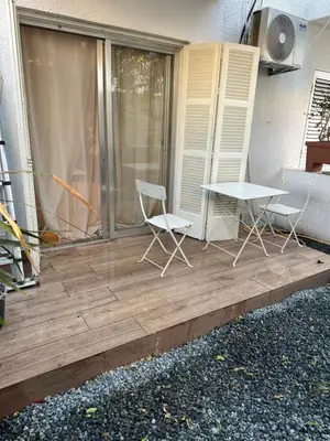 two chairs and a table on a deck at Ayia Napa 1 Studio in Ayia Napa