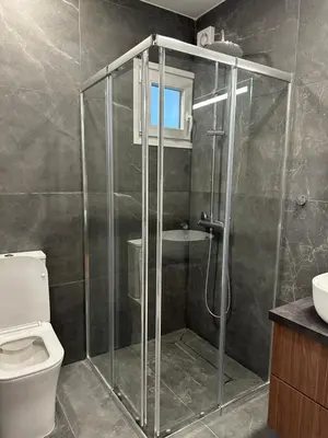 a bathroom with a shower with a toilet and a sink at Ayia Napa 1 Studio in Ayia Napa